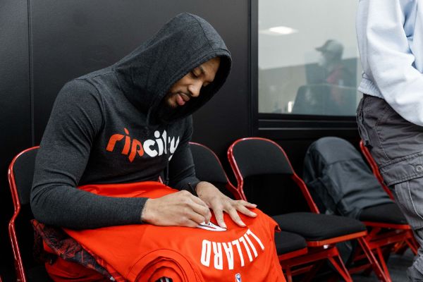 Picture of Damian Lillard Signing Jacob's Jerseys